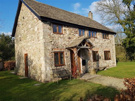 Holiday cottages bishops castle  Rolling Hills is situated in 50 acres of green fields with a babbling stream at the bottom of the valley